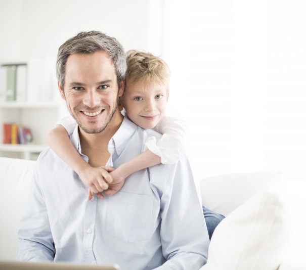 Father and his young son smiling